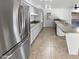 Modern kitchen featuring stainless steel appliances, ample counter space, and stylish tile flooring at 11020 N 45Th Ave, Glendale, AZ 85304