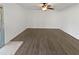 Bright living room featuring hardwood floors and a ceiling fan, creating a comfortable living space at 11020 N 45Th Ave, Glendale, AZ 85304