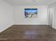 Bright living room with hardwood floors and a view of the backyard, creating an inviting and Gathering-friendly space at 11020 N 45Th Ave, Glendale, AZ 85304