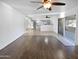 Spacious living room leading into an open kitchen with gray cabinets and a view to the backyard at 11020 N 45Th Ave, Glendale, AZ 85304