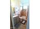 Well-lit bathroom featuring wood-look flooring, neutral tile shower, and gray vanity with granite countertop at 1127 N Sherwood Way, Queen Valley, AZ 85118