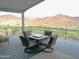 Covered deck with comfortable seating and beautiful mountain views at 1127 N Sherwood Way, Queen Valley, AZ 85118