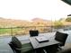 Cozy deck showcasing a stylish outdoor furniture and stunning mountain view at 1127 N Sherwood Way, Queen Valley, AZ 85118
