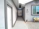 Inviting walkway leading to a charming home with dual doors at 1127 N Sherwood Way, Queen Valley, AZ 85118