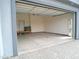 Spacious two-car garage with ample room for parking and storage, featuring an automatic door at 1127 N Sherwood Way, Queen Valley, AZ 85118