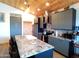 Well-equipped kitchen featuring granite countertops, modern appliances, and ample cabinet space at 1127 N Sherwood Way, Queen Valley, AZ 85118