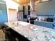 Stylish kitchen island with granite countertops, stainless steel appliances, and modern cabinetry at 1127 N Sherwood Way, Queen Valley, AZ 85118