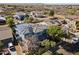 Aerial view of a home with solar panels, landscaping, and a well-maintained neighborhood at 12956 N 152Nd Ave, Surprise, AZ 85379