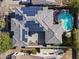 Bird's eye aerial of home showcasing solar panels on roof, with a pool and patio entertainment area at 12956 N 152Nd Ave, Surprise, AZ 85379
