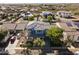 Aerial view of a home with solar panels, a well-manicured yard, and neighborhood at 12956 N 152Nd Ave, Surprise, AZ 85379