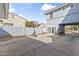 The backyard has a basketball hoop and doorway to home at 12956 N 152Nd Ave, Surprise, AZ 85379