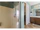 Modern bathroom featuring a glass-enclosed shower, a vanity with storage, and tiled floors at 12956 N 152Nd Ave, Surprise, AZ 85379