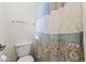 The bathroom features a toilet and patterned shower curtain at 12956 N 152Nd Ave, Surprise, AZ 85379