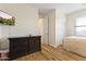 Bedroom view featuring a dresser, closet and doorway at 12956 N 152Nd Ave, Surprise, AZ 85379