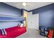 Cozy bedroom with blue walls, a ceiling fan, and a bunk bed, creating a comfortable and inviting space at 12956 N 152Nd Ave, Surprise, AZ 85379