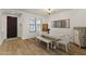 Elegant dining room with a modern table, stylish decor, and ample natural light at 12956 N 152Nd Ave, Surprise, AZ 85379