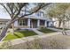 Charming two-story home boasts a brick-accented facade, fresh landscaping, and a welcoming front porch at 12956 N 152Nd Ave, Surprise, AZ 85379