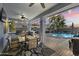 Outdoor kitchen, patio dining, pool, and backyard at 12956 N 152Nd Ave, Surprise, AZ 85379