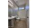 Clean bathroom featuring a shower-tub combination and a pedestal sink at 1304 S Owl Dr, Gilbert, AZ 85296
