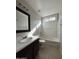 Bright bathroom with a combined shower and tub, vanity, and a large mirror at 1304 S Owl Dr, Gilbert, AZ 85296