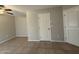 Neutral-toned bedroom with a ceiling fan and tiled floor, ready for personalization at 1304 S Owl Dr, Gilbert, AZ 85296