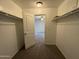 A tidy walk-in closet reveals easy access and an open door to the main bedroom at 1304 S Owl Dr, Gilbert, AZ 85296