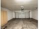 Spacious garage featuring a clean, light-colored door, and a light-colored built-in storage cabinet at 1304 S Owl Dr, Gilbert, AZ 85296