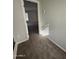 Hallway on the second floor with neutral walls and plush carpeting, enhanced by ample natural light at 1304 S Owl Dr, Gilbert, AZ 85296