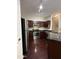 Well-equipped kitchen featuring stainless steel appliances, dark wood cabinets, and modern lighting at 1304 S Owl Dr, Gilbert, AZ 85296