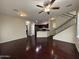 Spacious living area with hardwood floors and open access to the kitchen and staircase at 1304 S Owl Dr, Gilbert, AZ 85296