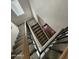 This staircase features light carpet, light wood, and modern black metal banisters at 1304 S Owl Dr, Gilbert, AZ 85296