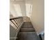 Carpeted stairway leading to the upper level, featuring neutral walls and two white doors at 1304 S Owl Dr, Gilbert, AZ 85296