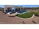Backyard with a pool, spa, and artificial turf at 13616 W Junipero Dr, Sun City West, AZ 85375