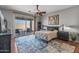 Comfortable bedroom with outdoor access, stylish furnishings, and a serene ambiance at 13616 W Junipero Dr, Sun City West, AZ 85375