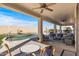 View of the covered patio and pool at 13616 W Junipero Dr, Sun City West, AZ 85375