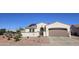Charming single-story home with a well-maintained landscape, a two car garage, and solar panels on the roof at 13616 W Junipero Dr, Sun City West, AZ 85375