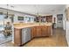 Spacious kitchen island with stainless steel dishwasher offers modern convenience and a great view at 13616 W Junipero Dr, Sun City West, AZ 85375
