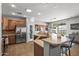 Spacious kitchen features stainless steel appliances and an eat-in bar, perfect for gatherings at 13616 W Junipero Dr, Sun City West, AZ 85375