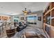 Open concept living area with patio access, dining space, and views of the backyard at 13616 W Junipero Dr, Sun City West, AZ 85375
