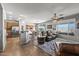 Open concept living area featuring a kitchen bar, and patio access to an outdoor living space at 13616 W Junipero Dr, Sun City West, AZ 85375