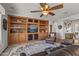 Comfortable living room featuring a custom built-in cabinet and a relaxing seating area at 13616 W Junipero Dr, Sun City West, AZ 85375