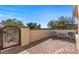 Private patio featuring brick flooring and wrought iron gate, perfect for outdoor relaxation at 13616 W Junipero Dr, Sun City West, AZ 85375