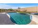 This backyard pool has a spa and desert landscaping at 13616 W Junipero Dr, Sun City West, AZ 85375