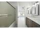 This stylish bathroom features a double vanity and a separate shower and tub at 14398 W Marcus Dr, Surprise, AZ 85374
