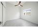 A bright bedroom featuring a large window, closet and neutral paint at 14398 W Marcus Dr, Surprise, AZ 85374