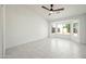 Bright Primary bedroom with a bay window offering plenty of natural light and tile flooring at 14398 W Marcus Dr, Surprise, AZ 85374