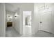 The entryway showcases an elegant chandelier and provides access to multiple rooms at 14398 W Marcus Dr, Surprise, AZ 85374