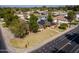 Aerial view of a home featuring a well-manicured lawn, mature trees, and solar panels at 1610 E Mclellan Rd, Mesa, AZ 85203