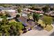 Overhead shot of home with solar panels, fenced yard, mature trees, and a convenient driveway at 1610 E Mclellan Rd, Mesa, AZ 85203