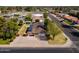 Aerial view shows home with solar panels, long driveway, and a fenced in back yard at 1610 E Mclellan Rd, Mesa, AZ 85203